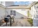 Outdoor patio area with a grill, a small outdoor table, and serene surrounding at 4108 Twenty Grand Dr, Indian Trail, NC 28079