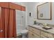 Bathroom featuring granite countertops, a framed mirror, and a shower with rust colored shower curtain at 420 Spring Arbor Ave # 80, Salisbury, NC 28146