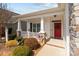 Charming front porch with rocking chairs and a vibrant red door, perfect for relaxing at 420 Spring Arbor Ave # 80, Salisbury, NC 28146