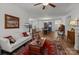 Open-concept living room with hardwood floors flowing into the dining area, filled with natural light at 420 Spring Arbor Ave # 80, Salisbury, NC 28146