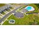 Aerial view of community with pool, clubhouse, playground, parking and manicured landscaping at 4223 Black Ct # 195, Harrisburg, NC 28075