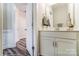 Bathroom featuring a white vanity, neutral walls, and modern fixtures and mirror at 4223 Black Ct # 195, Harrisburg, NC 28075