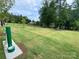 Dog park amenities: green space with dog washing station and water bowl at 4223 Black Ct # 195, Harrisburg, NC 28075