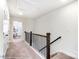 Upstairs hallway with carpet and a view of the bedroom in a well-lit home at 4235 Black Ct # 197, Harrisburg, NC 28075