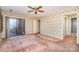 Spacious bedroom featuring a glass door, neutral-toned walls, and two access doors at 4309 Woodglen Ln, Charlotte, NC 28226