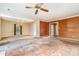 Spacious living room with a ceiling fan, neutral-toned walls, chandelier and large windows at 4309 Woodglen Ln, Charlotte, NC 28226