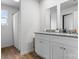 Spacious bathroom featuring a double vanity, granite countertops, and wood-look floors at 4496 Springs Rd, Conover, NC 28613