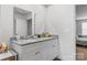 Well-lit bathroom with a double vanity, modern mirrors, and granite countertops at 4496 Springs Rd, Conover, NC 28613