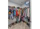 Walk-in closet with organized clothing, shoes, and carpeted floor at 4496 Springs Rd, Conover, NC 28613