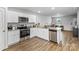 Functional kitchen with stainless steel appliances, granite countertops, and sleek white cabinetry at 4496 Springs Rd, Conover, NC 28613