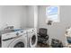 Functional laundry room featuring white washer and dryer and natural light at 4496 Springs Rd, Conover, NC 28613