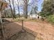 Backyard features brick patio and partial fence at 4801 Kipling Dr, Charlotte, NC 28212