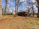 Large backyard with mature trees providing shade and privacy at 4801 Kipling Dr, Charlotte, NC 28212