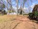 Spacious backyard features mature trees at 4801 Kipling Dr, Charlotte, NC 28212