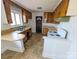 Functional kitchen design featuring wooden cabinetry, countertops, and a vintage white oven at 4801 Kipling Dr, Charlotte, NC 28212