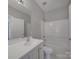 Bright bathroom with white vanity, tub/shower combination and updated fixtures at 6724 Mallard Park Dr, Charlotte, NC 28262