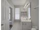 Bathroom featuring double vanity and bright natural light at 6724 Mallard Park Dr, Charlotte, NC 28262