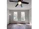 Sunlit bedroom featuring hardwood floors and two windows at 6724 Mallard Park Dr, Charlotte, NC 28262