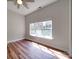 Bright bedroom featuring hardwood floors and a large window that provides ample natural light and recessed lighting at 6724 Mallard Park Dr, Charlotte, NC 28262