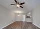 Open-concept living room with hardwood floors, a ceiling fan, and seamless transition to the kitchen, perfect for entertaining at 6724 Mallard Park Dr, Charlotte, NC 28262