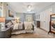Cozy bedroom with carpet, ceiling fan, window and well decorated, with light blue walls at 7025 Ridgeway Rd, Stanley, NC 28164