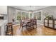 Cozy dining room features hardwood floors, backyard views, and a modern chandelier at 7025 Ridgeway Rd, Stanley, NC 28164