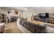 Open concept living room featuring carpet, entertainment center, ceiling fan, and furniture at 7025 Ridgeway Rd, Stanley, NC 28164