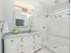 Modern bathroom with white marble vanity, glass shower and ceramic tile at 800 Water Wheel Ct, Charlotte, NC 28209