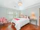 Bright bedroom with hardwood floors, a sloped ceiling, and ample natural light at 800 Water Wheel Ct, Charlotte, NC 28209