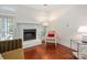 Inviting living room with a fireplace, comfortable chair, and natural light at 800 Water Wheel Ct, Charlotte, NC 28209