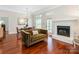 Cozy living room featuring a fireplace, dining area and comfortable seating at 800 Water Wheel Ct, Charlotte, NC 28209