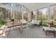 Relaxing screened porch featuring stylish furniture and natural light at 800 Water Wheel Ct, Charlotte, NC 28209