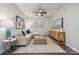 Inviting living room with comfortable sofa, area rug, modern decor, ceiling fan and decorative lighting at 8637 Miles Gap Rd, Indian Land, SC 29707