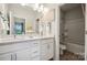 Bright bathroom with double vanity, white cabinets, and separate tub and shower at 8646 Miles Gap Rd, Indian Land, SC 29707