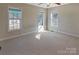 Bedroom with neutral carpet, three windows, and ample natural light at 9530 Driftwood Ct, Hickory, NC 28601