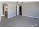 Bedroom with neutral carpet, en-suite bathroom, and good natural light at 9530 Driftwood Ct, Hickory, NC 28601