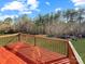 Spacious wooden deck with backyard views, perfect for outdoor entertaining on a sunny day at 9530 Driftwood Ct, Hickory, NC 28601