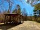 Lakeside picnic pavilion surrounded by trees, with tables, benches and shade at 9530 Driftwood Ct, Hickory, NC 28601