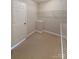 Carpeted walk-in closet featuring wire shelving for optimal storage and organization at 9530 Driftwood Ct, Hickory, NC 28601