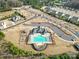 Aerial view of a community pool and playground, great for outdoor fun and relaxation at 9762 Verdun Ct, Indian Land, SC 29707