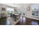 Dining room with large windows, hardwood floors, and modern decor at 9762 Verdun Ct, Indian Land, SC 29707