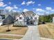 Beautiful two-story home with a three-car garage and well-manicured front yard at 9762 Verdun Ct, Indian Land, SC 29707