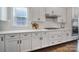 Kitchen featuring white cabinets, subway tile backsplash, and modern appliances at 9762 Verdun Ct, Indian Land, SC 29707