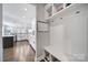 Functional mudroom with built-in bench and storage, leading to a modern kitchen at 9762 Verdun Ct, Indian Land, SC 29707