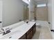 Bright bathroom featuring a double vanity, large mirror, and a shower-tub combination with tiled walls at 1007 Equipoise Dr, Indian Trail, NC 28079