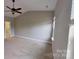 Bright bedroom with carpet, neutral walls, and a ceiling fan, providing a comfortable and versatile space at 1007 Equipoise Dr, Indian Trail, NC 28079