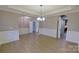 Bright living room featuring hardwood flooring, elegant trim, and an open layout, ideal for entertaining at 1007 Equipoise Dr, Indian Trail, NC 28079