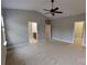 Spacious main bedroom featuring neutral carpet, a ceiling fan, and ensuite bathroom access at 1007 Equipoise Dr, Indian Trail, NC 28079