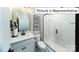 Modern bathroom features a glass-enclosed shower, stylish vanity, and contemporary fixtures at 1010 Merganser Way, Indian Trail, NC 28079