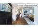 Elegant foyer with dark wood flooring, stylish console table, and decorative wall art at 1010 Merganser Way, Indian Trail, NC 28079